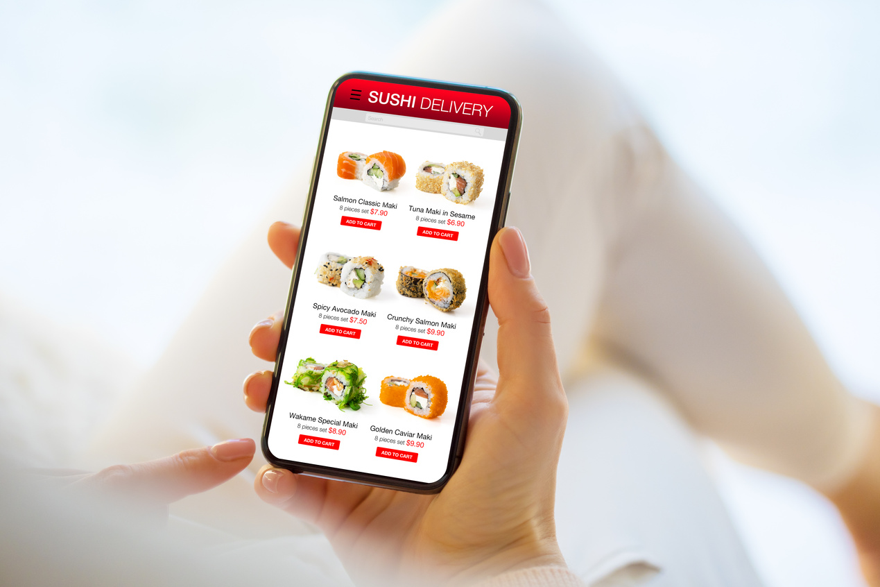 Woman Ordering Sushi Online for Home Delivery